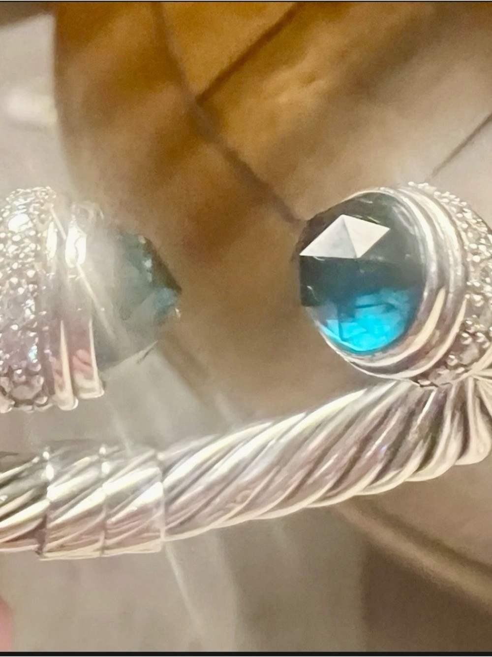 Silver-Tone Open Cable Bangle with Blue Crystal End Caps